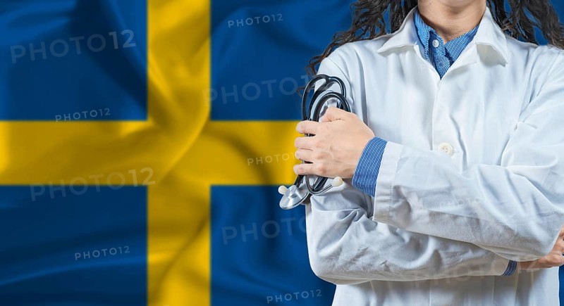 Healthcare professional with Sweden flag background. Professional doctor holding stethoscope on Sweden flag background