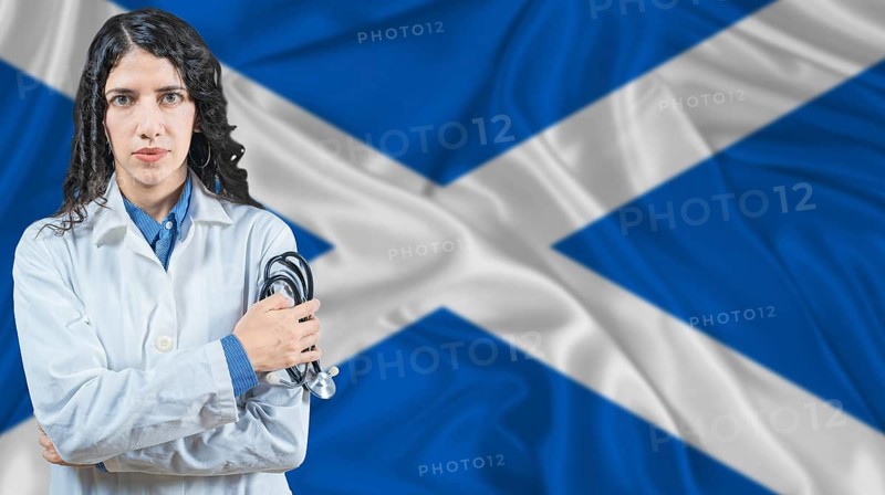 Scottish national health system, Medical professional on Scotland flag background