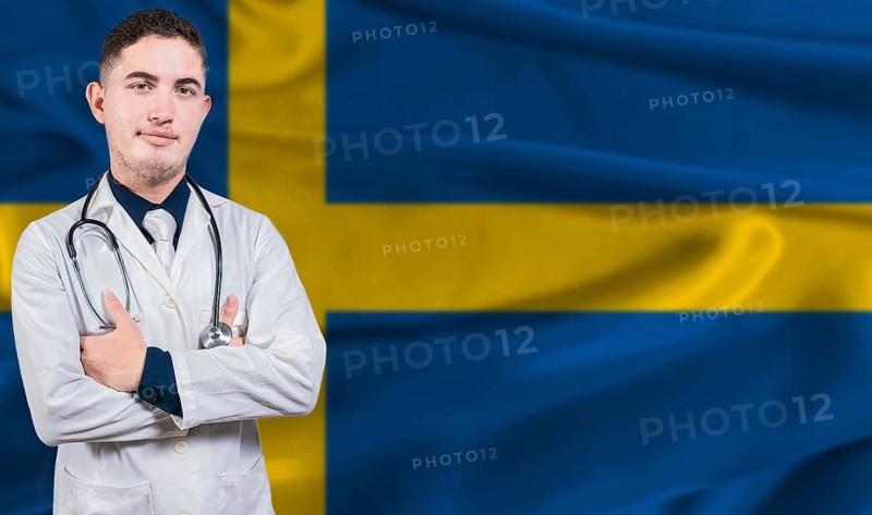 Portrait of medical professional on Sweden flag background. Swedish national health system