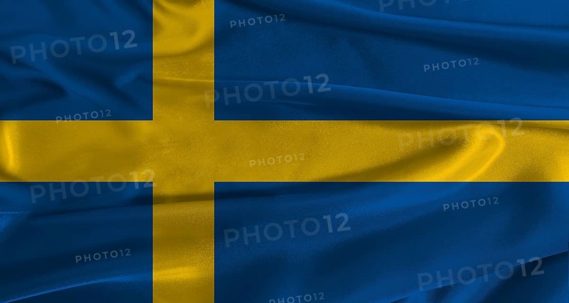 Flag of Sweden with fabric textured background. Close up of National flag of Sweden with realistic texture