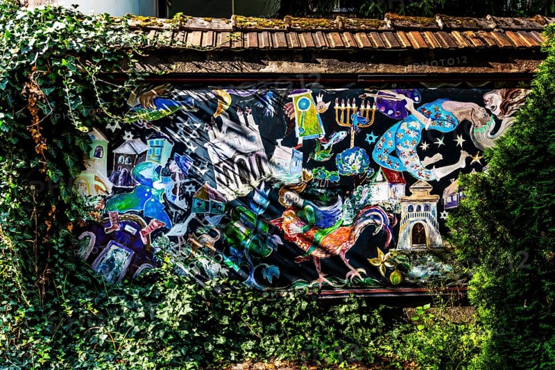 Street art on the wall of a building in the Kazimierz Jewish Quarter, a historically significant, formerly independent district that developed into an important center of Jewish culture since the 14th century, Krakow, Poland