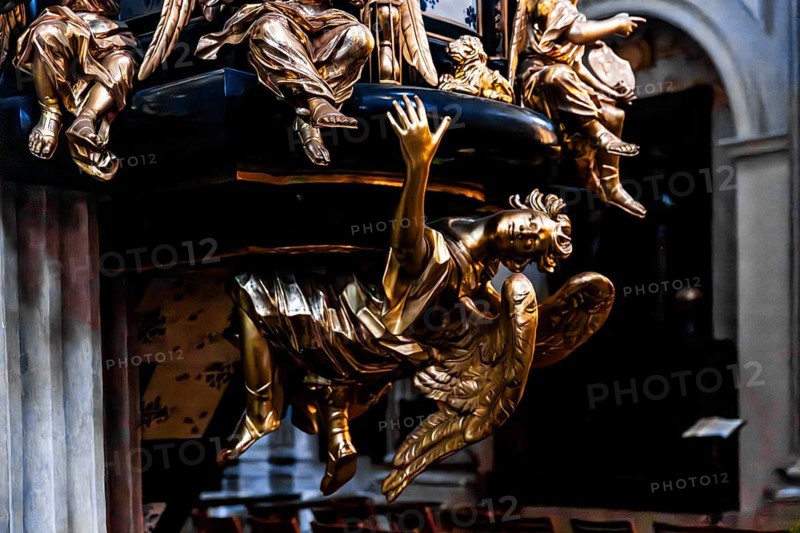 Richly decorated pulpit with intricate golden carvings, angel on the pulpit has symbolic meaning and serves as an announcing figure, by Antoni Frackiewicz, St. Anna Church in Baroque style, 1381, Krakow, Poland