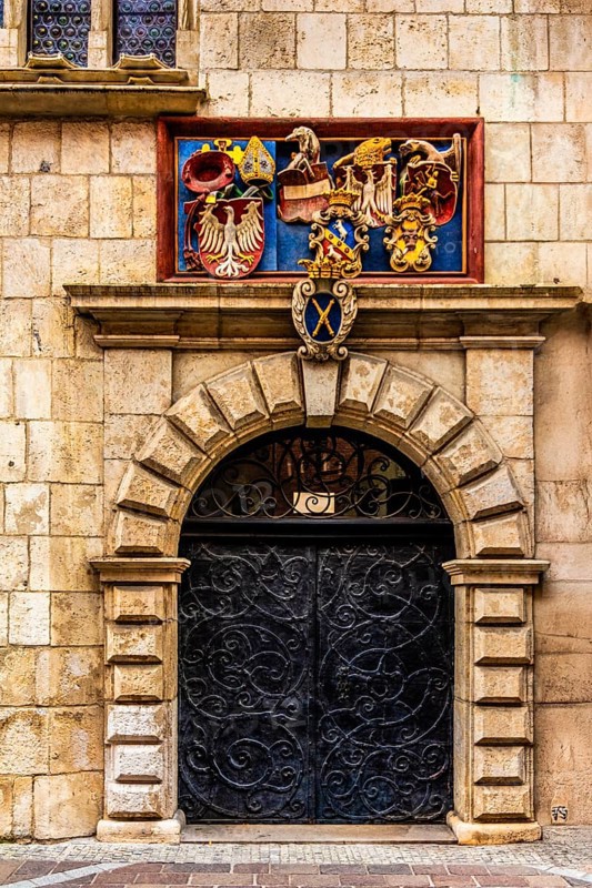 Entrance portal with coat of arms, Collegium Maius oldest building of the Jagellonian University, 1364, Krakow, Poland