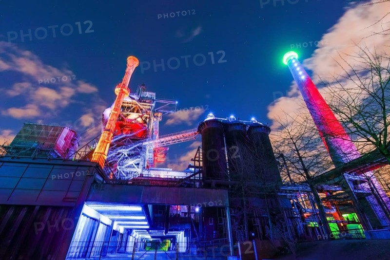 Bright and colorful lighting of an industrial plant at night, Landschaftspark Duisburg Nord, Duisburg, North Rhine-Westphalia, Germany