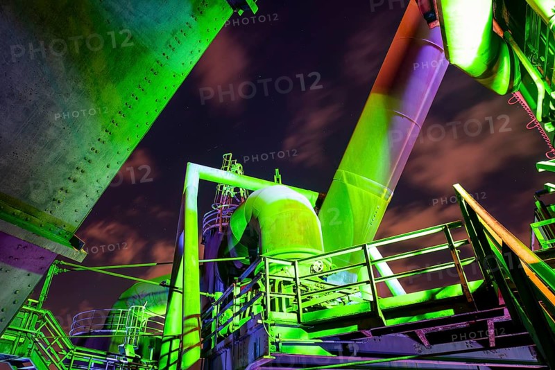 Detailed view of a metallic industrial plant illuminated with green and purple lights, Landschaftspark Duisburg Nord, Duisburg, North Rhine-Westphalia, Germany