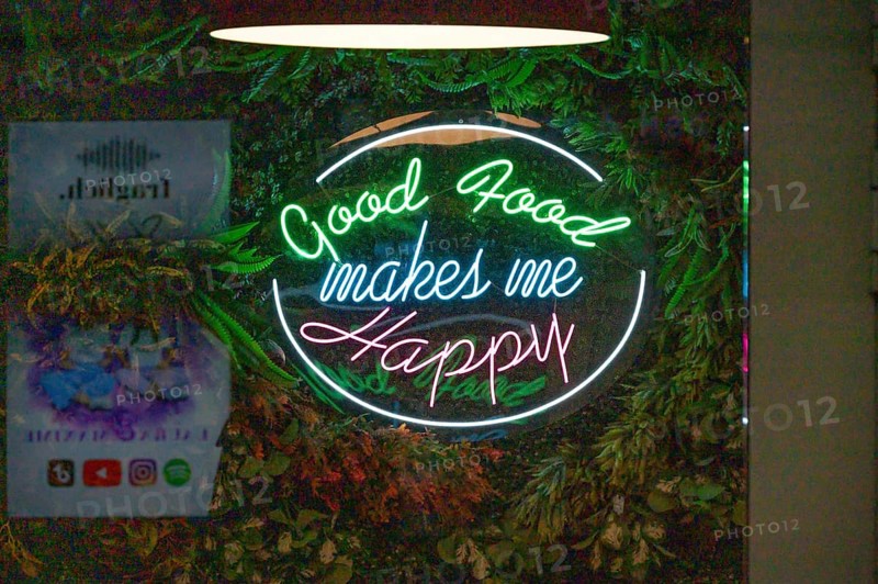 Illuminated advertising at a restaurant, Nuremberg, Middle Franconia, Bavaria, Germany