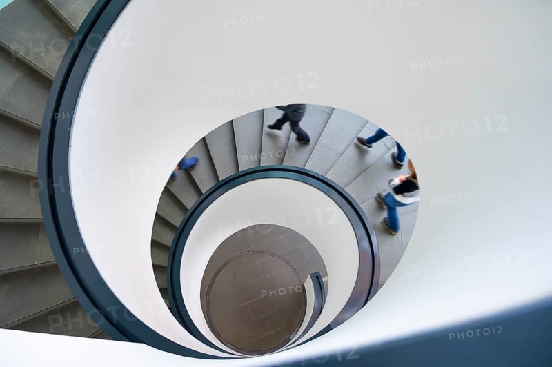 Spiral staircase with descending persons, Bavaria, Germany
