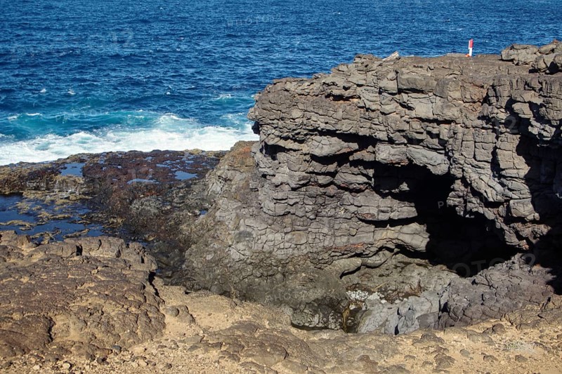 Rugged coastal formation with dramatic cliffs and breaking waves, Playa Blanca Lanzarote