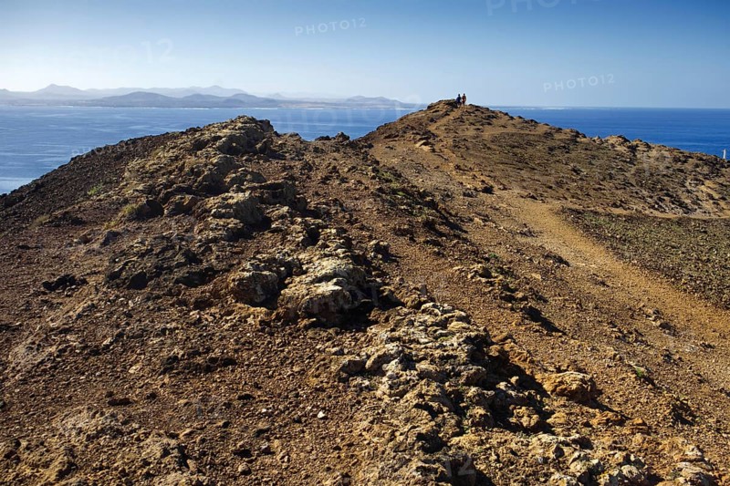 View of the sea and the neighboring island of Fuerteventura, Playa Blanca Lanzarote, from the summit of the Montana Roja volcano