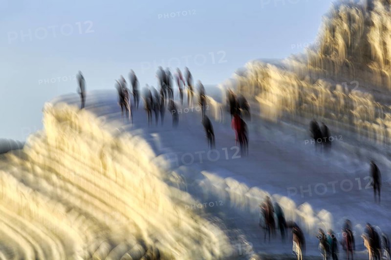 Terraced chalk cliffs Scala dei Turchi, anonymous walkers on Turkish steps, illustration, motion blur, Realmonte, Agrigento, Sicily, south coast, Mediterranean, Italy