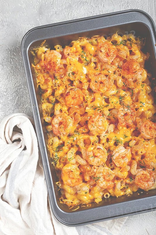Pasta with shrimp and cheese, with a golden crust, cooked in a baking dish, homemade, no people