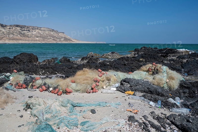 Garbage, fishing nets and plastic on the beach, Oman