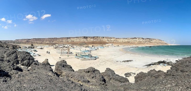 Fishing village with boats on the beach, near Ras Madrakah, Oman