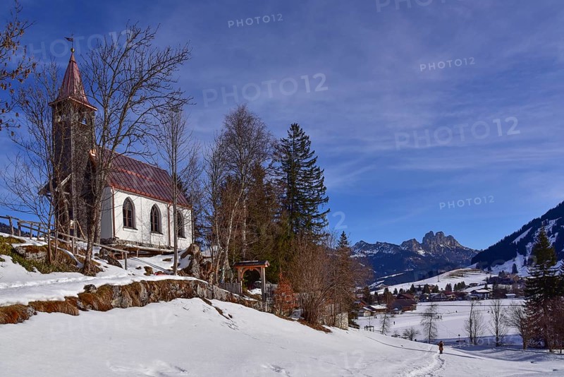 The Lourdes Chapel above Tannheim in the background the Rote Flüh, the Gimpel and the Köllnspitze, in the Tannheimer Valley in Tyrol in Austria