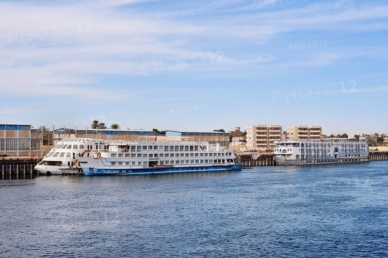 Nile cruise ships at a pier on the banks of the Nile, Egypt