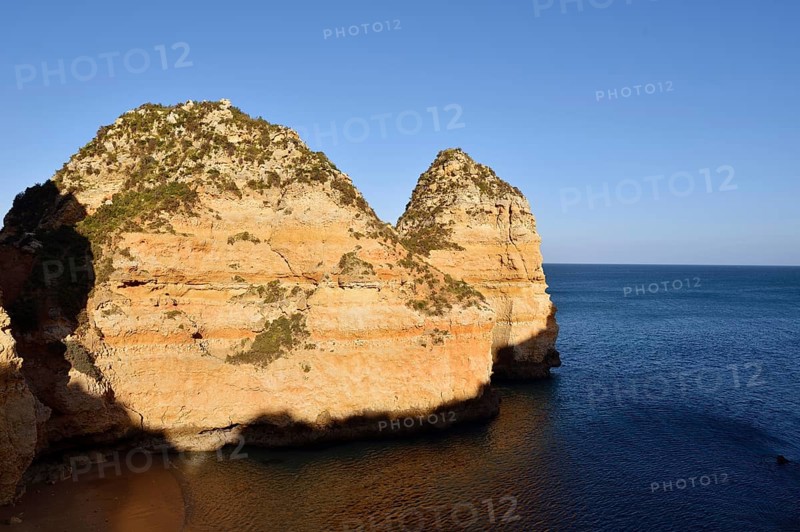 Rocky coast in evening light, Ponta da Piedade, Lagos, Algarve, Portugal