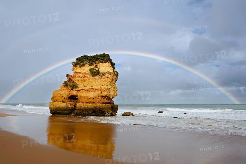 Rocks on beach with rainbow, Praia Dona Ana, Lagos, Algarve, Portugal