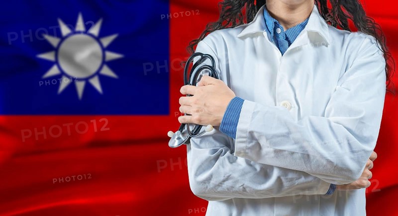 Healthcare professional with Taiwan flag background. Professional doctor holding stethoscope on Taiwan flag background