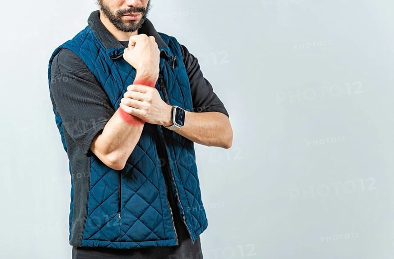 People with wrist pain isolated, Young man with pain in the hands, man with arthritis rubbing wrist