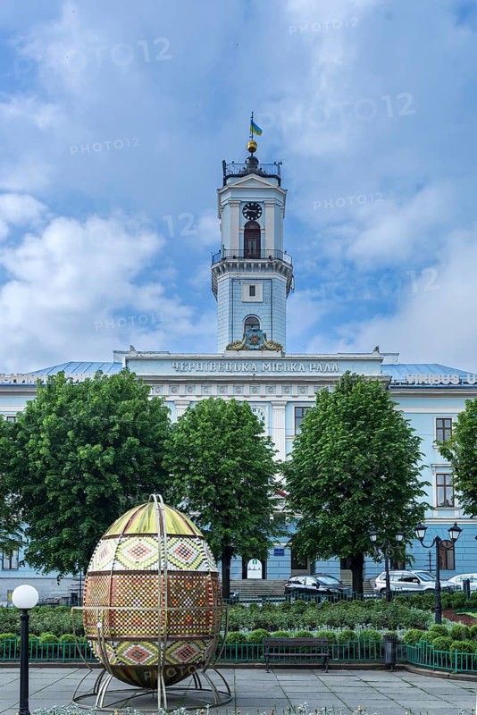 Traditional embroidered Easter egg, City Hall in the back, Chernivtsi, Ukraine