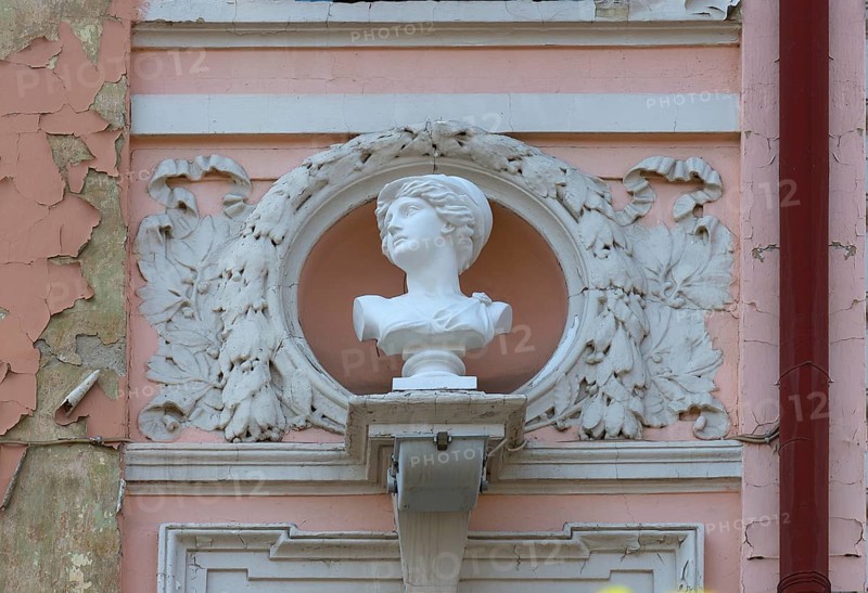 Bust of a woman on a dilapidated 19th century house façade, Czernowicz, Ukraine