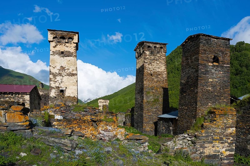 Stone towers in a historic village under clear blue sky in a hilly landscape, defensive towers, Ushguli, Murqmeli district, Upper Svaneti, Svaneti, Georgia