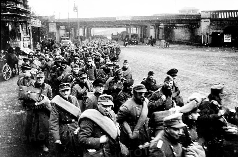 Under the York Bridges in Friedrichshain-Kreuzberg, German prisoners of war, early May 1945 J. Chaldej about this photo: I took many photos of prisoners of war in Berlin. It's very interesting how they reacted. They were ashamed of being prisoners in their own city. Here under the York Bridges, Berlin