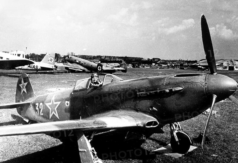 Soviet pilot with plane at Tempelhof Airport in Berlin May, 1945, Germany