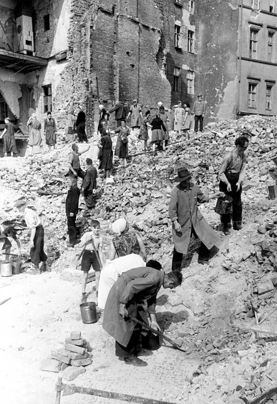 Civilians remove the rubble of a destroyed residential building, July 1945, Berlin, Germany