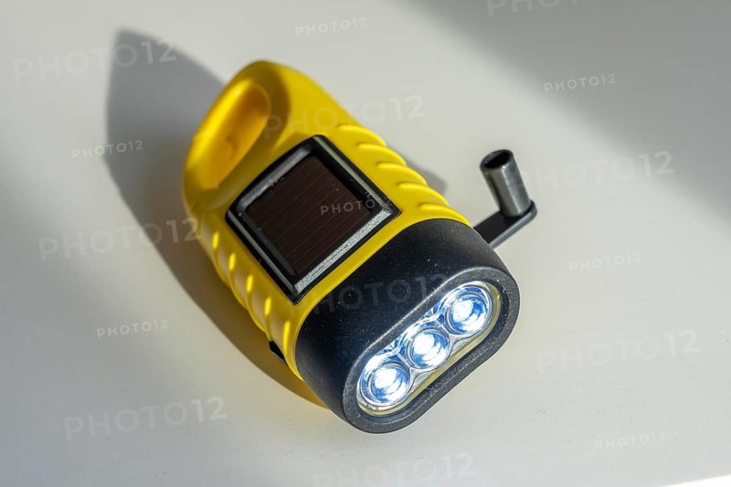 Crank operated flashlight, by turning the crank, we generate electricity in a dynamo, which charges a battery in the flashlight, in addition a small solar module to generate electricity from sunlight, for emergency preparedness in the event of a power failure, blackout, energy supply