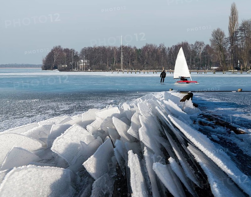 Eisfloes Steinhuder Meer winter with ice sailor and skater Steinhude Germany