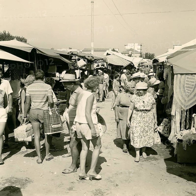Historical photo summer 1961, market with tourists, Rimini, Italy