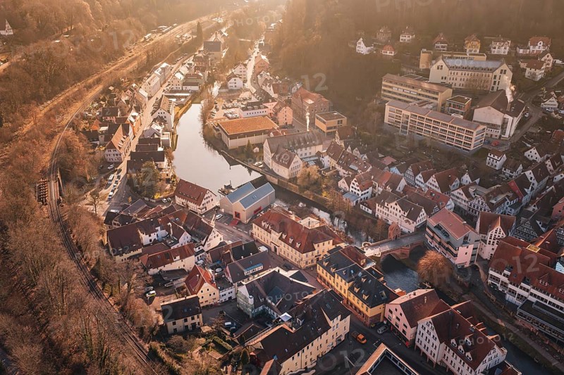 City view with river and buildings in sunlight from a bird's eye view, measurement trip on the new Hermann-Hesse railway with Siemens Mireo Plus B trains, Calw, Germany