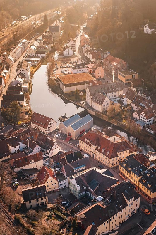 Historic city on a river, surrounded by trees and old buildings, test trip on the new Hermann-Hesse railway with Siemens Mireo Plus B trains, Calw, Germany