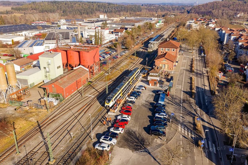 Industrial area with freight yard, parked vehicles and rails, test run on the new Hermann-Hesse railway with Siemens Mireo Plus B trains, Calw, Germany