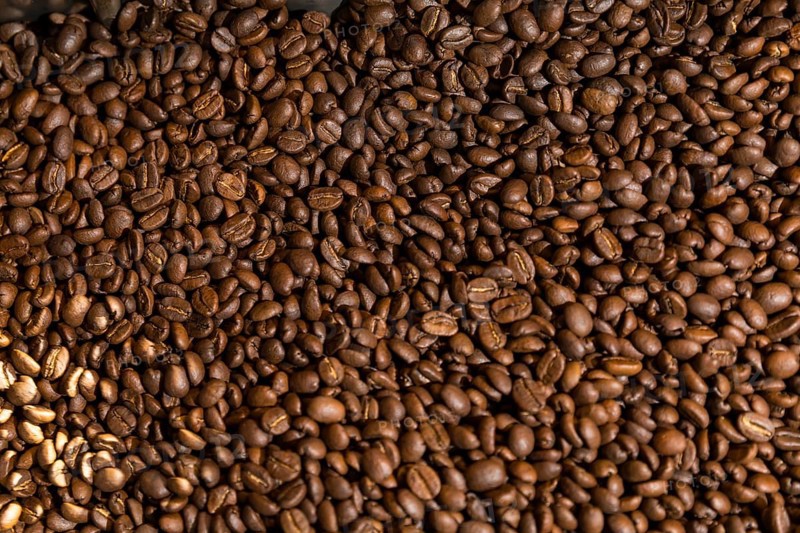 Coffee is roasted by hand in a small drum roaster with lots of experience, where the hot freshly roasted coffee beans cool down using air in a sieve, Kaffeerösterei Müller, Wildenhain, Großenhain, Saxony, Germany