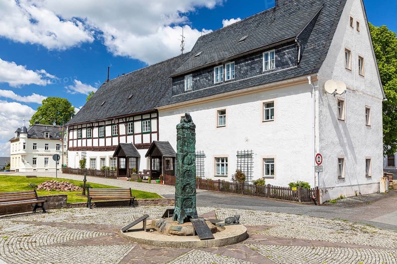 Market fountain with historical column on Bärenstein market square, Altenberg, Saxony, Germany