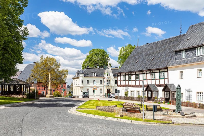 Market square with post mile column in Bärenstein, Altenberg, Eastern Ore Mountains, Saxony, Germany