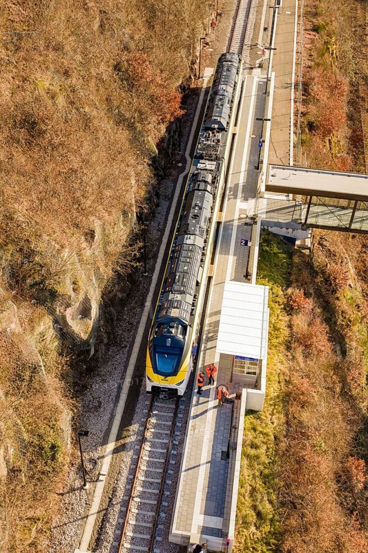 Bird's eye view of a train at a station in an autumn landscape, test trip on the new Hermann-Hesse railway with Siemens Mireo Plus B trains, Calw, Germany