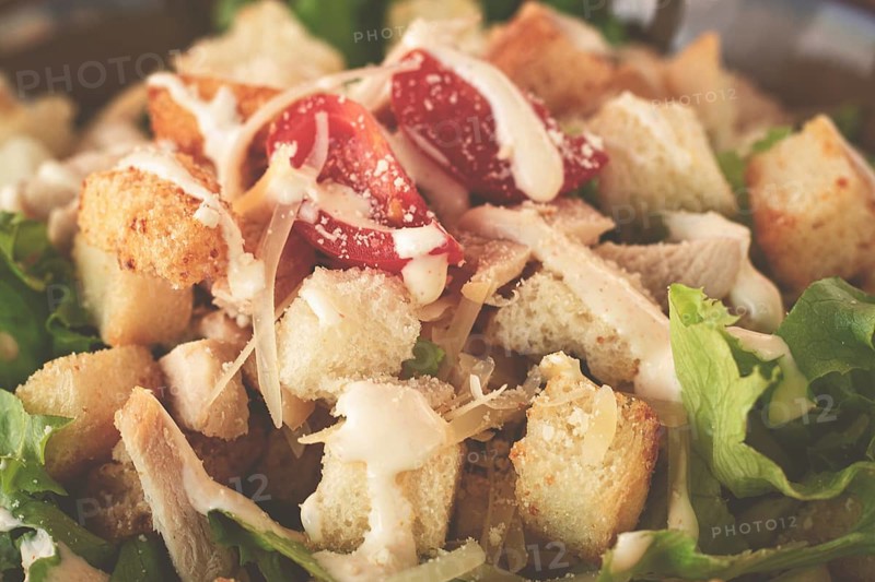 Classic Caesar salad, close-up, natural light, selective focus, horizontal