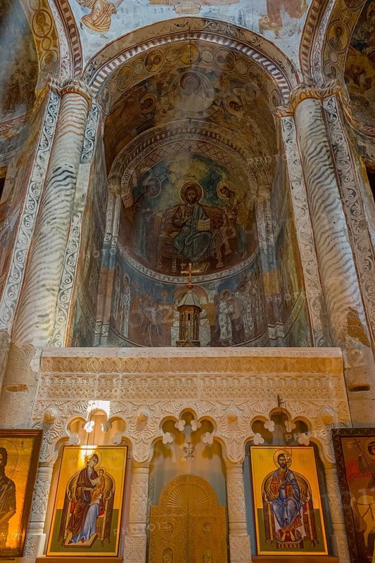 Richly decorated Orthodox church wall with frescoes and icons in the interior, Nikorzminda Cathedral, Racha-Lechkhumi region, Lower Svaneti, Georgia