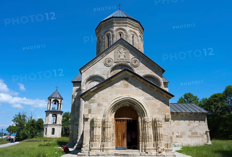 Stone church with detailed façade under clear blue sky, Nikorzminda Cathedral, Nikorzminda Cathedral, Racha-Lechkhumi region, Lower Svaneti, Georgia