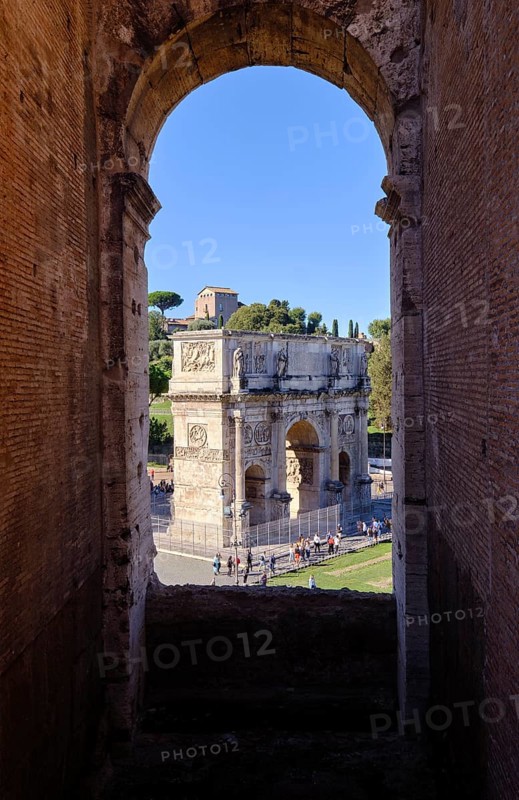 View through round arch of Constantine's Arch from the Colosseum, Rome, Lazio, Italy