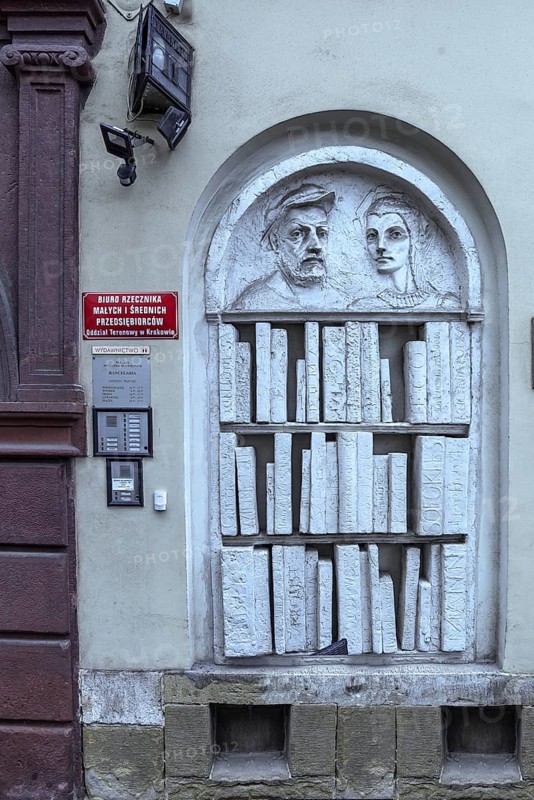 Relief of a bookshelf with sculptures, Krakow, Poland