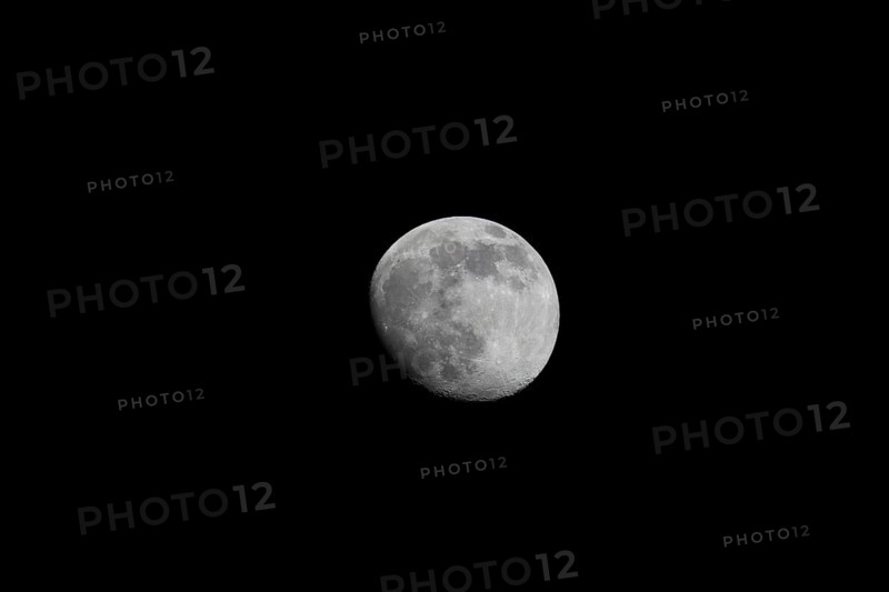 The moon is highly detailed and clearly visible against a black night sky, Dümmer nature park Park, Lower Saxony, Germany