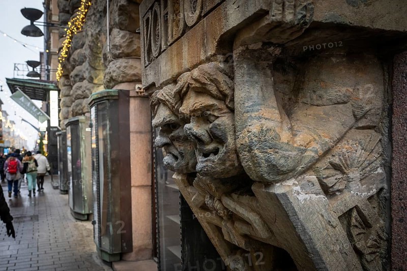 Trolls, stone figures from Kalevala, art nouveau architecture, Pohjola insurance building, Alexanterinkatu, main shopping street in the city center, Helsinki, Finland