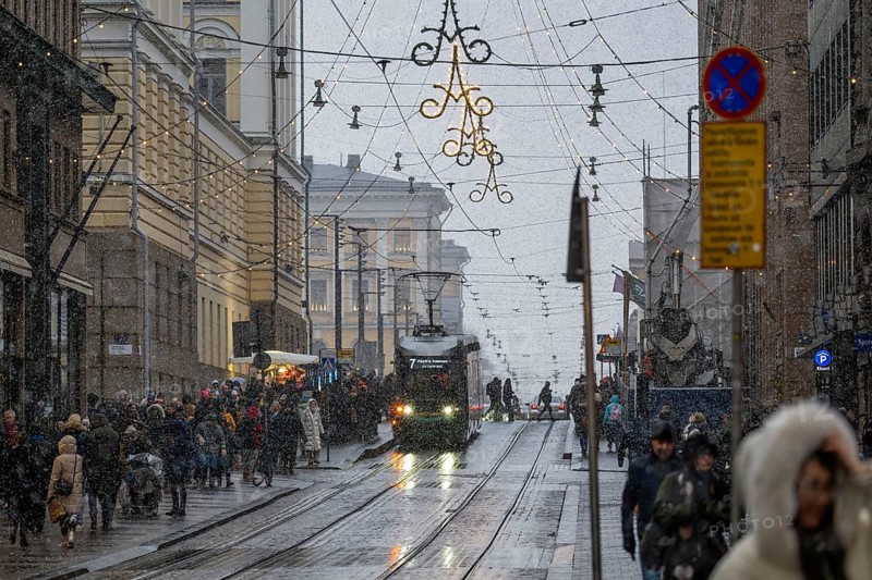 Alexanterinkatu, main shopping street in the city center, designed by Carl Ludwig Engel, Christmas decoration, tram tracks, snowfall, Helsinki, Finland