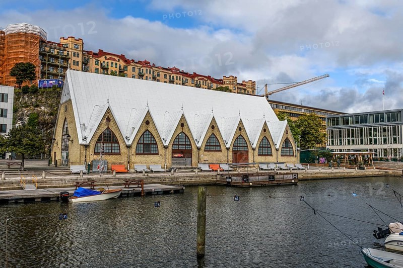 Large historic market hall in Gothenburg with pointed roof on the water, Gothenburg, Västra Götalands län, Sweden