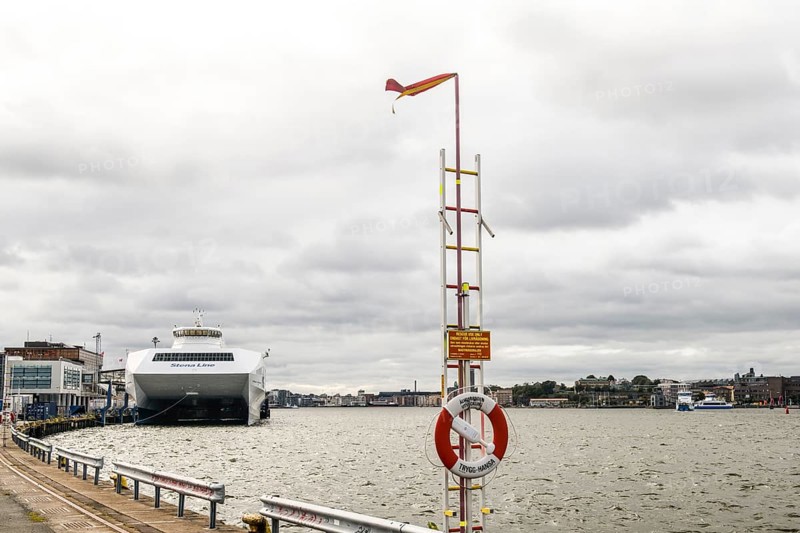 Stena Line fast ferry catamartan in port on a cloudy day with lifebuoy in the foreground, Stena Line Gothenburg-Frederikshavn, Gothenburg, Västra Götalands län, Sweden