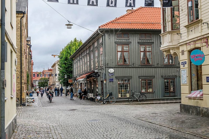 Charming old town with cobblestones and historic buildings, people walking on the street in Gothenburg's Haga district, Gothenburg, Västra Götalands län, Sweden